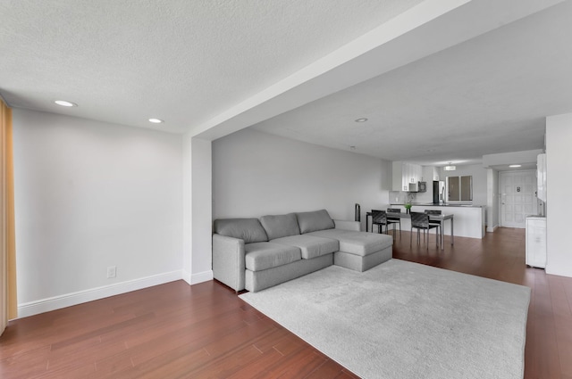 4489 Luxemburg Ct Unit 306, Lake Worth, FL 33467 - living area with dark wood-style floors, recessed lighting, baseboards, and a textured ceiling