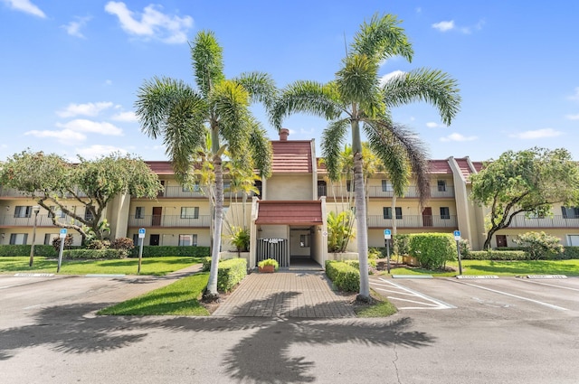 4489 Luxemburg Ct Unit 306, Lake Worth, FL 33467 - view of property featuring uncovered parking