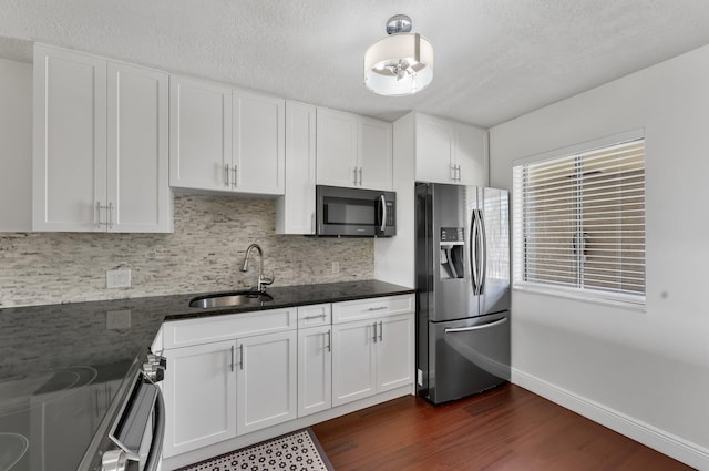 4489 Luxemburg Ct Unit 306, Lake Worth, FL 33467 - kitchen with stainless steel fridge with ice dispenser, a sink, dark wood-style flooring, backsplash, and electric range