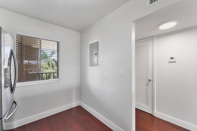 4489 Luxemburg Ct Unit 306, Lake Worth, FL 33467 - unfurnished room featuring electric panel, dark wood finished floors, and baseboards