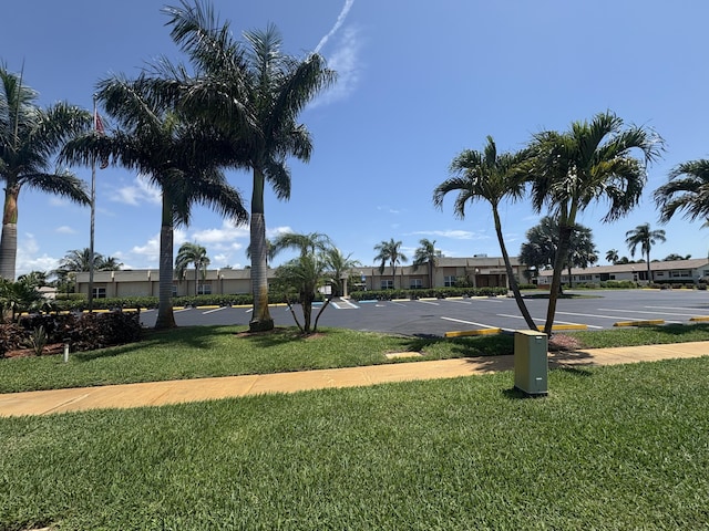 2822 Crosley Dr W Unit D, West Palm Beach, FL 33415 - view of home's community featuring a lawn, uncovered parking, and a residential view