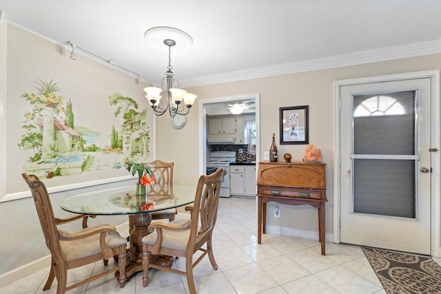 2822 Crosley Dr W Unit D, West Palm Beach, FL 33415 - dining room with crown molding, a chandelier, light tile patterned flooring, and baseboards