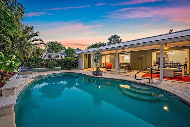 2590 Monaco Ter, Palm Beach Gardens, FL 33410 - outdoor pool featuring an outdoor living space, a patio, and a ceiling fan