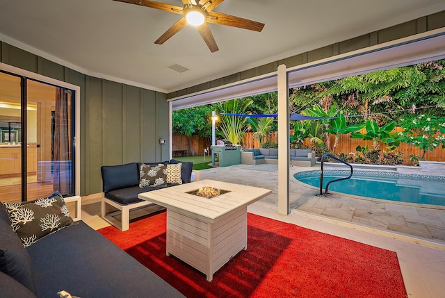 2590 Monaco Ter, Palm Beach Gardens, FL 33410 - fenced backyard with an outdoor living space with a fire pit, a patio, and a ceiling fan