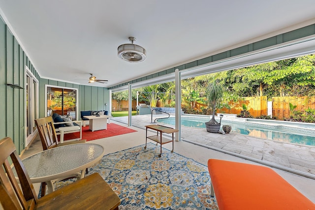 2590 Monaco Ter, Palm Beach Gardens, FL 33410 - sunroom featuring ceiling fan and an outdoor living space