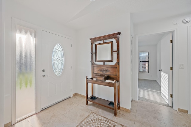 2590 Monaco Ter, Palm Beach Gardens, FL 33410 - entrance foyer featuring light tile patterned floors and baseboards