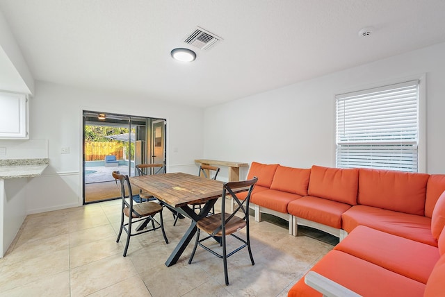 2590 Monaco Ter, Palm Beach Gardens, FL 33410 - dining room with baseboards and light tile patterned floors