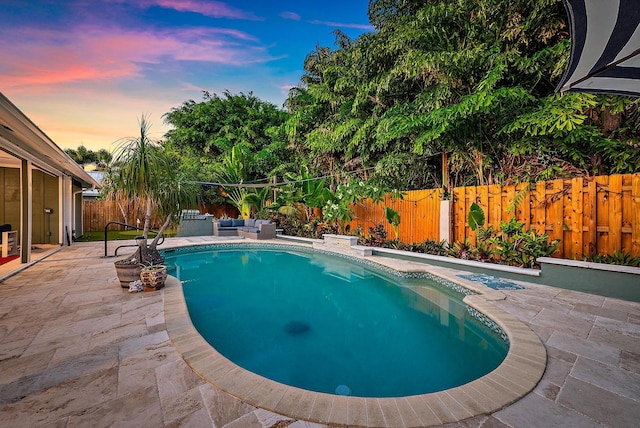2590 Monaco Ter, Palm Beach Gardens, FL 33410 - pool at dusk featuring a patio area, a fenced backyard, and outdoor lounge area