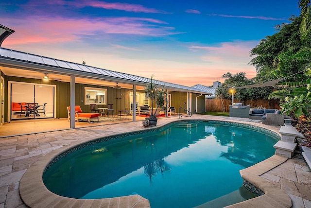2590 Monaco Ter, Palm Beach Gardens, FL 33410 - pool at dusk with an outdoor hangout area, a patio area, and ceiling fan