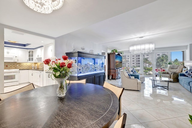 4100 Galt Ocean Dr Unit 311, Fort Lauderdale, FL 33308 - dining space with a chandelier and light tile patterned floors