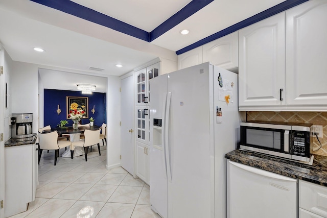 4100 Galt Ocean Dr Unit 311, Fort Lauderdale, FL 33308 - kitchen with white appliances, white cabinets, decorative backsplash, glass insert cabinets, and recessed lighting