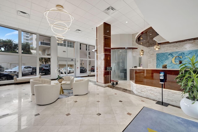 4100 Galt Ocean Dr Unit 311, Fort Lauderdale, FL 33308 - community lobby with a towering ceiling and floor to ceiling windows
