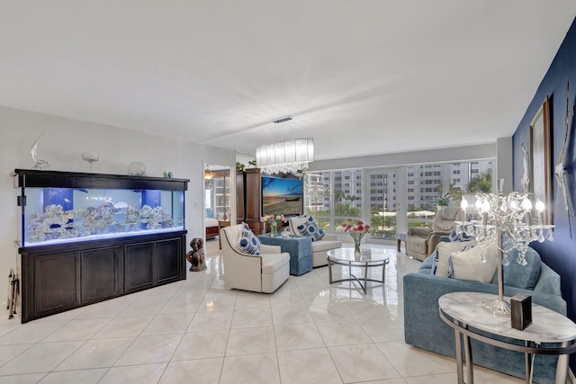 4100 Galt Ocean Dr Unit 311, Fort Lauderdale, FL 33308 - living room with light tile patterned floors and a chandelier