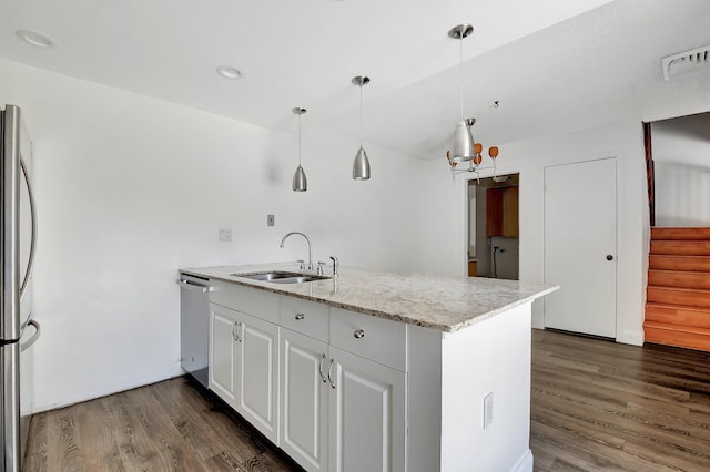 6604 66th Way, West Palm Beach, FL 33409 - kitchen featuring a sink, appliances with stainless steel finishes, dark wood-style flooring, decorative light fixtures, and light stone countertops
