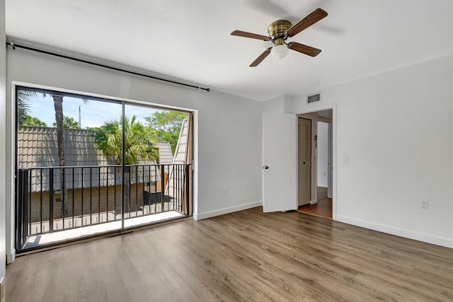6604 66th Way, West Palm Beach, FL 33409 - spare room with ceiling fan, wood finished floors, and baseboards