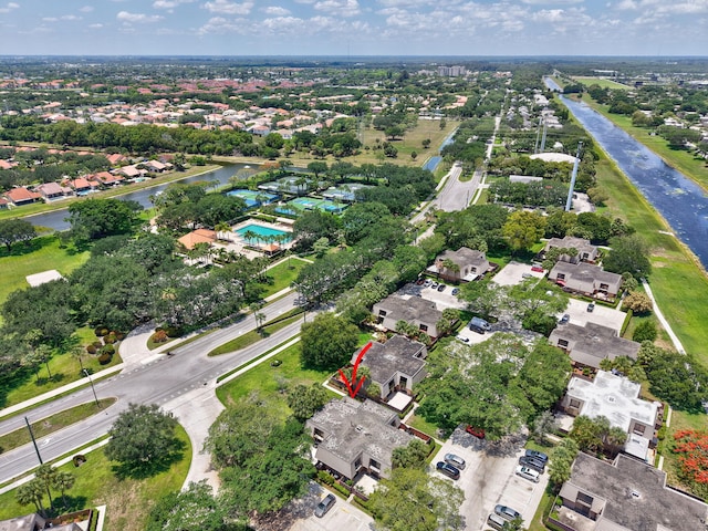6604 66th Way, West Palm Beach, FL 33409 - aerial overview of property's location with a nearby body of water, nearby suburban area, and a pool