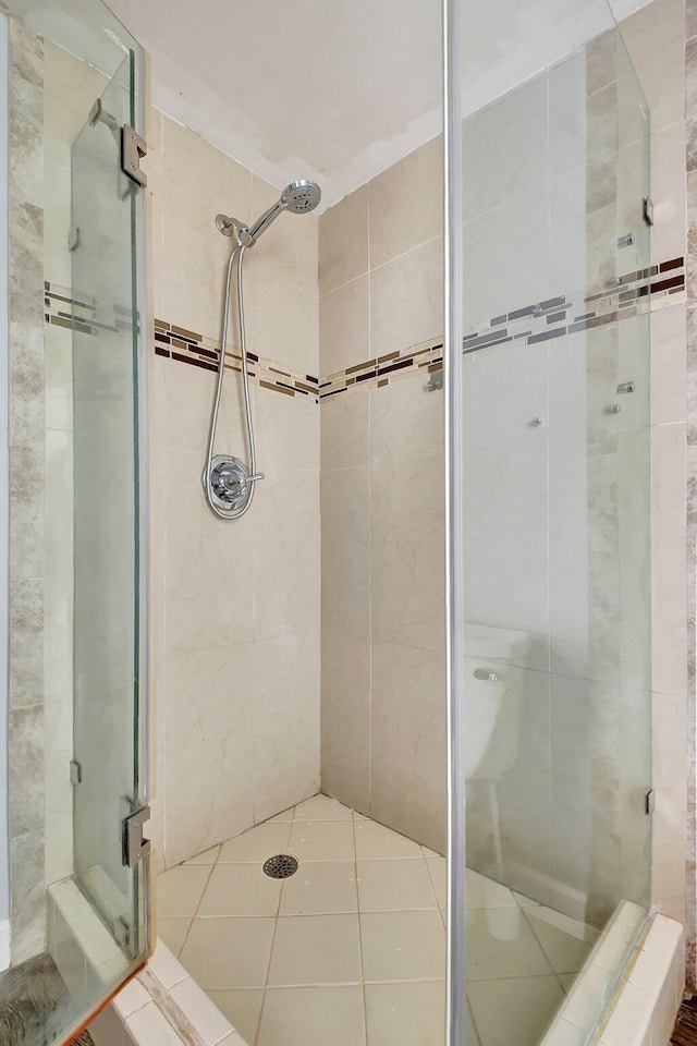 6604 66th Way, West Palm Beach, FL 33409 - bathroom featuring a shower stall and tile patterned flooring