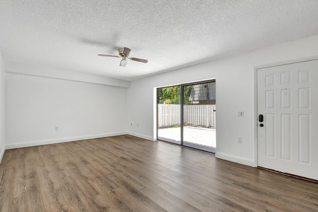 6604 66th Way, West Palm Beach, FL 33409 - spare room featuring a ceiling fan, wood finished floors, baseboards, and a textured ceiling