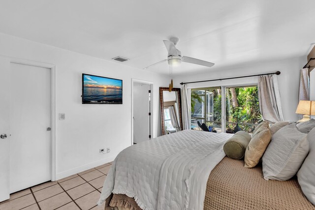 498 Oregon Ln, Boca Raton, FL 33487 - bedroom with light tile patterned floors, baseboards, and ceiling fan