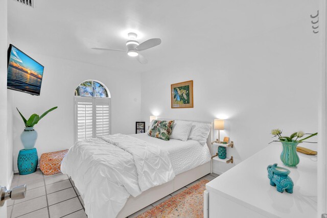 498 Oregon Ln, Boca Raton, FL 33487 - bedroom with ceiling fan and light tile patterned flooring