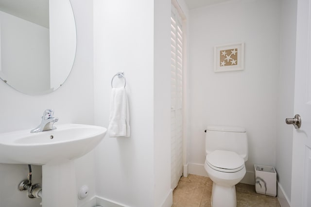 5405 NW 27th Ct, Margate, FL 33063 - bathroom with toilet, baseboards, and tile patterned flooring
