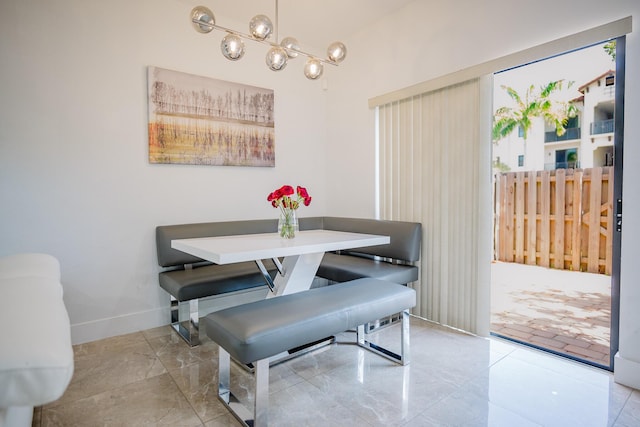 5405 NW 27th Ct, Margate, FL 33063 - dining space with a chandelier and baseboards