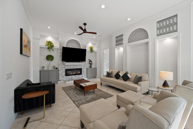 1936 SW Wood Duck Ln, Palm City, FL 34990 - living area with a ceiling fan, ornamental molding, a glass covered fireplace, light tile patterned flooring, and recessed lighting