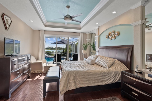 1936 SW Wood Duck Ln, Palm City, FL 34990 - bedroom with access to outside, ornamental molding, a raised ceiling, wood finished floors, and a sunroom