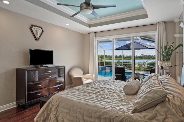 1936 SW Wood Duck Ln, Palm City, FL 34990 - bedroom featuring ornamental molding, access to outside, dark wood-style flooring, a raised ceiling, and baseboards