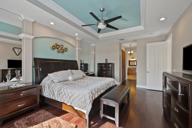1936 SW Wood Duck Ln, Palm City, FL 34990 - bedroom with a tray ceiling, dark wood finished floors, ornamental molding, recessed lighting, and decorative columns