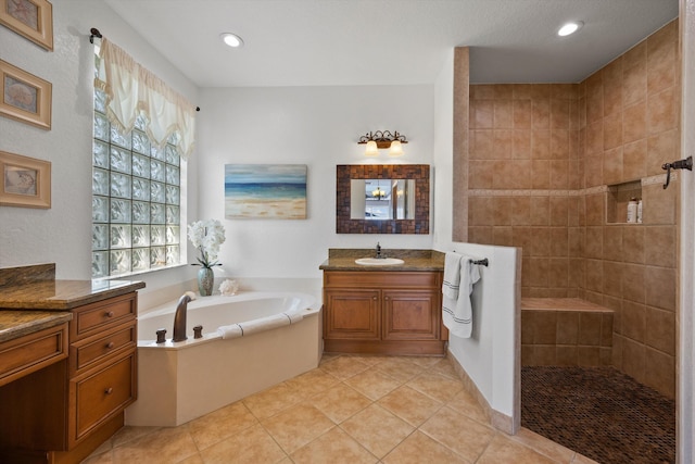 1936 SW Wood Duck Ln, Palm City, FL 34990 - full bath with vanity, a bath, a walk in shower, tile patterned floors, and recessed lighting