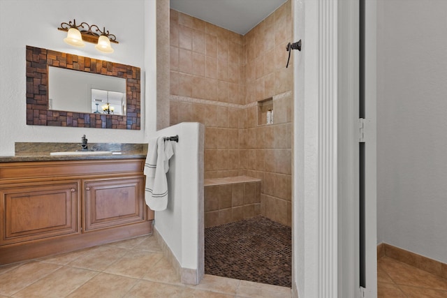 1936 SW Wood Duck Ln, Palm City, FL 34990 - full bathroom with walk in shower, tile patterned flooring, vanity, and baseboards