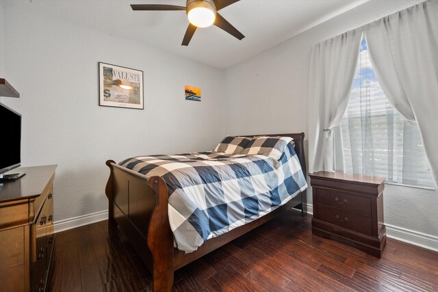 1936 SW Wood Duck Ln, Palm City, FL 34990 - bedroom with baseboards, wood finished floors, and ceiling fan
