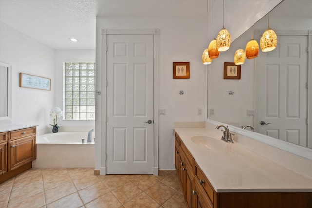 1936 SW Wood Duck Ln, Palm City, FL 34990 - bathroom featuring vanity, a garden tub, tile patterned flooring, and recessed lighting