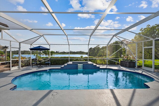 1936 SW Wood Duck Ln, Palm City, FL 34990 - swimming pool featuring a patio area, a water view, a lanai, and an in-ground hot tub