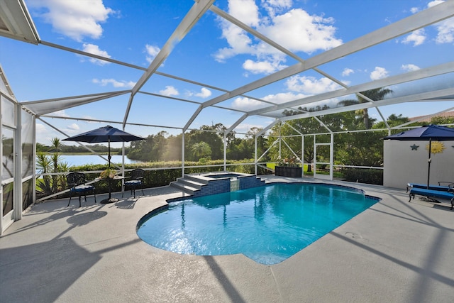 1936 SW Wood Duck Ln, Palm City, FL 34990 - view of pool featuring a patio area, a pool with connected hot tub, and a lanai