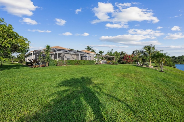 1936 SW Wood Duck Ln, Palm City, FL 34990 - view of green lawn with a lanai and a water view