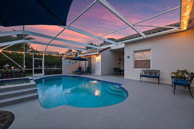1936 SW Wood Duck Ln, Palm City, FL 34990 - view of swimming pool featuring a patio, a lanai, and a pool with connected hot tub