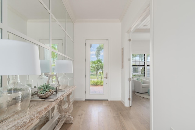640 SE Boboli Way, Port Saint Lucie, FL 34984 - entryway with ornamental molding, light wood finished floors, and baseboards