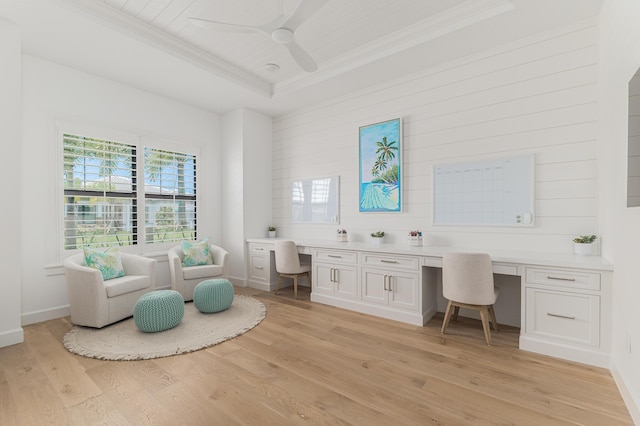 640 SE Boboli Way, Port Saint Lucie, FL 34984 - office featuring built in desk, crown molding, ceiling fan, light wood finished floors, and a raised ceiling