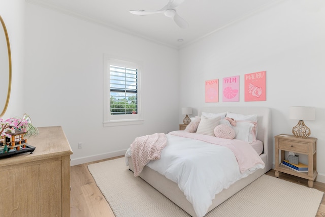 640 SE Boboli Way, Port Saint Lucie, FL 34984 - bedroom with ornamental molding, light wood-type flooring, baseboards, and a ceiling fan