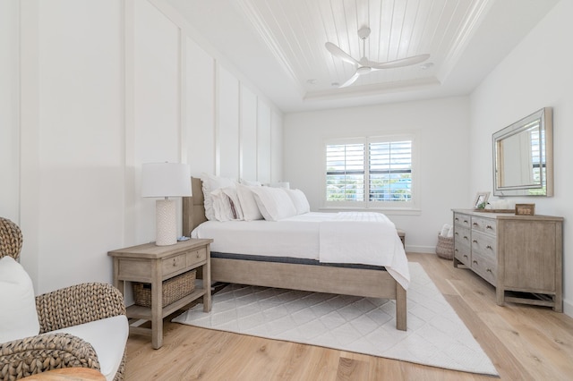 640 SE Boboli Way, Port Saint Lucie, FL 34984 - bedroom with a raised ceiling, ornamental molding, light wood-style floors, and ceiling fan