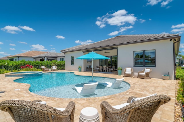 640 SE Boboli Way, Port Saint Lucie, FL 34984 - view of pool with a patio, a pool with connected hot tub, and outdoor dining area