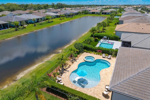 640 SE Boboli Way, Port Saint Lucie, FL 34984 - view of swimming pool with a pool with connected hot tub, a fenced backyard, a residential view, a water view, and a patio