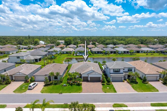 640 SE Boboli Way, Port Saint Lucie, FL 34984 - aerial perspective of suburban area featuring a nearby body of water