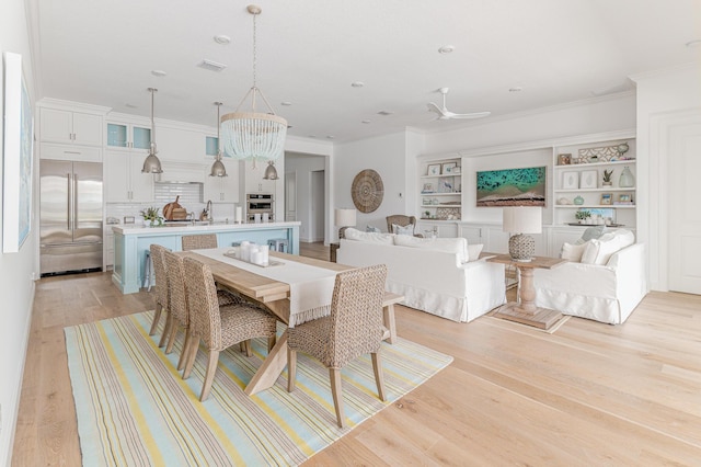 640 SE Boboli Way, Port Saint Lucie, FL 34984 - dining area featuring ornamental molding and light wood-type flooring
