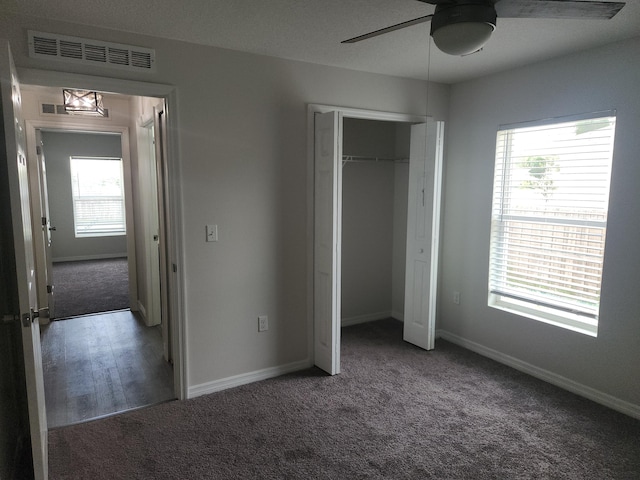 1721 SE Biddle Ln, Port Saint Lucie, FL 34983 - unfurnished bedroom featuring carpet flooring, multiple windows, and baseboards