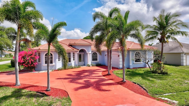 1897 SW Citation Ave, Port Saint Lucie, FL 34953 - mediterranean / spanish house featuring a tile roof, stucco siding, and an attached garage