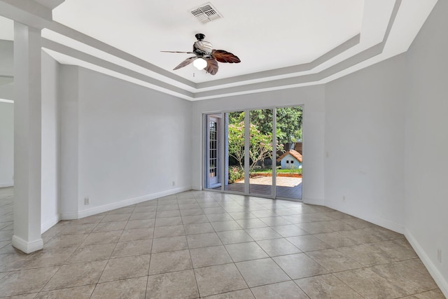 1897 SW Citation Ave, Port Saint Lucie, FL 34953 - spare room with a ceiling fan, a raised ceiling, baseboards, and light tile patterned flooring