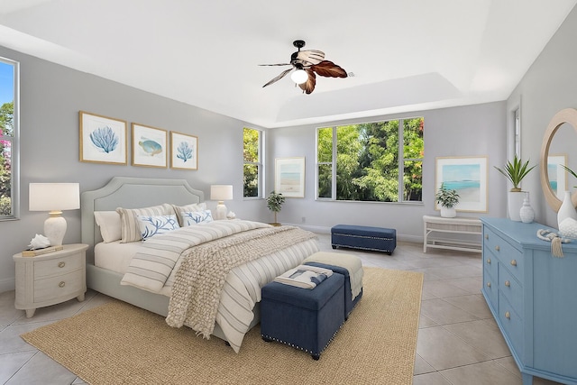 1897 SW Citation Ave, Port Saint Lucie, FL 34953 - bedroom featuring light tile patterned floors, a raised ceiling, and a ceiling fan